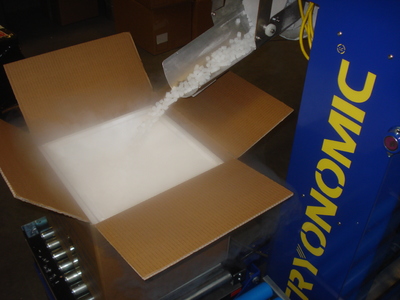 Dry ice being poured into a box