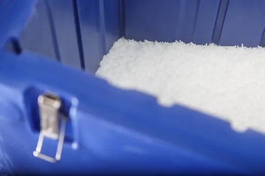 CIP-5XS Dry Ice Production Machine distributing dry ice pellets into a storage container