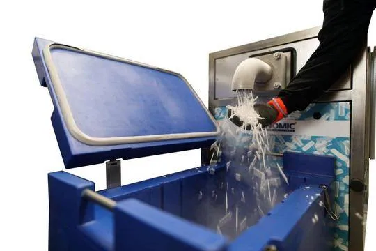 Dry Ice Repacking machine shown operational and distributing load into a container.