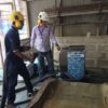 Two people using COMBI72 to clean mould